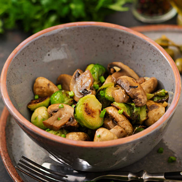 vegan-dish-baked-mushrooms-with-brussels-sprouts-PZGFBLT.jpg